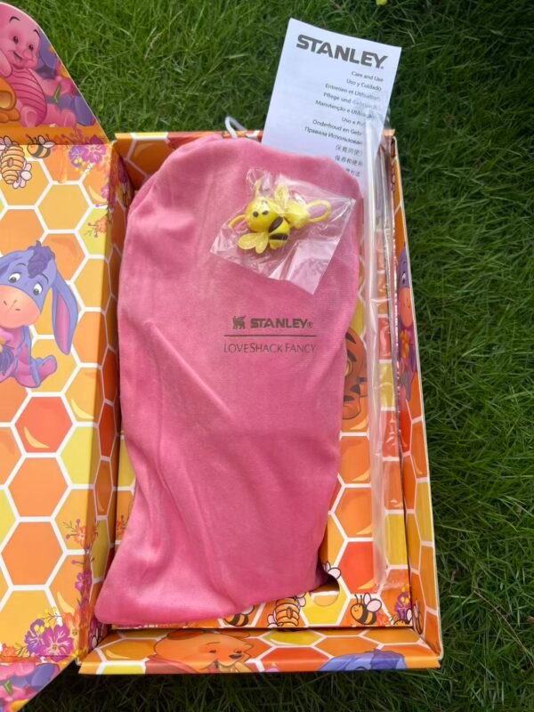 3Custom honeycomb Winnie the Pooh and friends Stanley Cup 40 oz with 3D bee straw topper, matching gift box, and pink dust bag Pooh and friends-inspired tumbler with pink velvet pouch