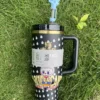 Black candy character tumbler with blue bow straw topper
