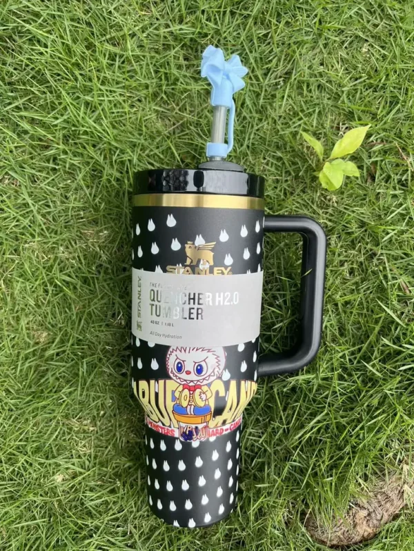 Black candy character tumbler with blue bow straw topper